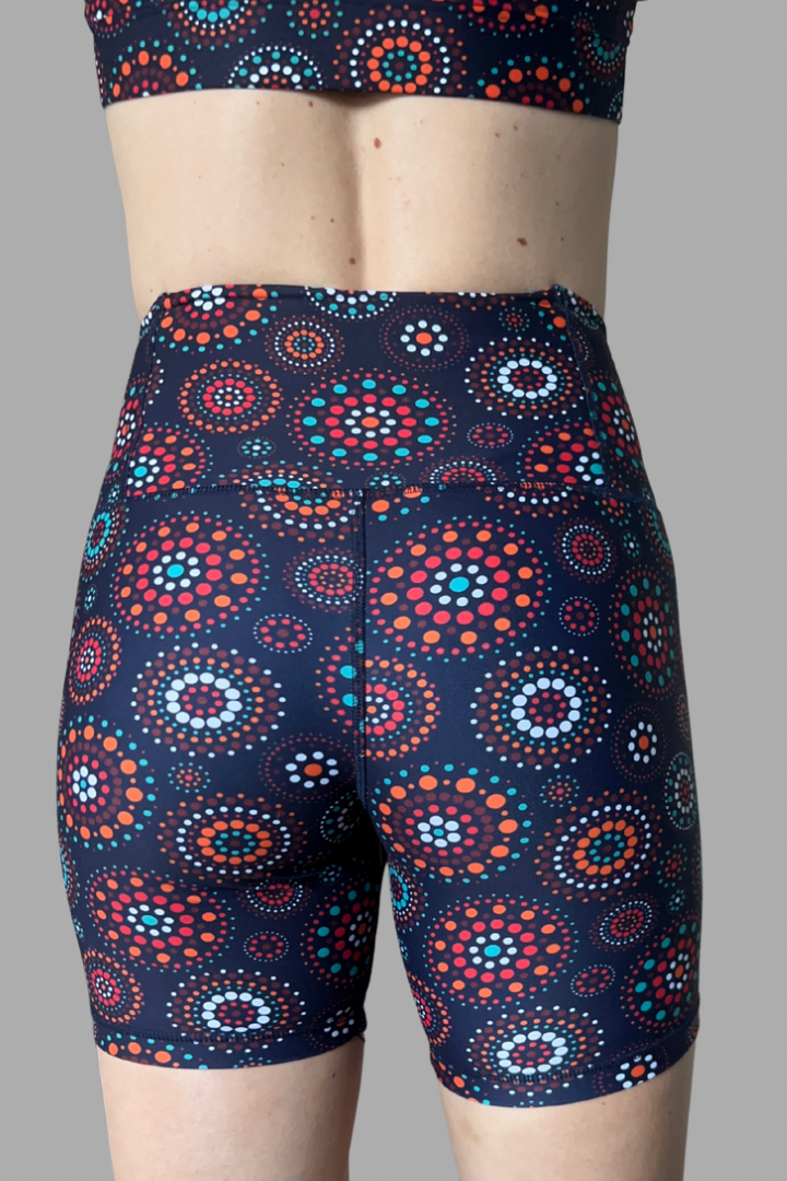 Patterned shorts with a colorful design on a gray background