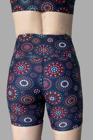 Patterned shorts with a colorful design on a gray background
